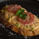 Toasted Bread topped with crab, tomatoes and parmesan