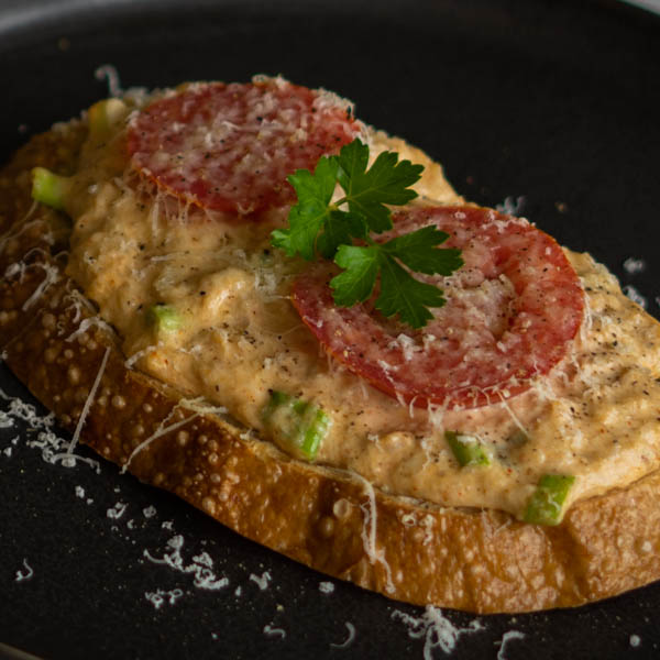 Toasted Bread topped with crab, tomatoes and parmesan