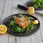 Breaded chicken served over salad with lemon dressing