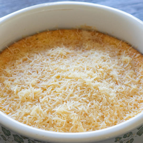 Cream Corn Casserole topped with Parmesan Cheese